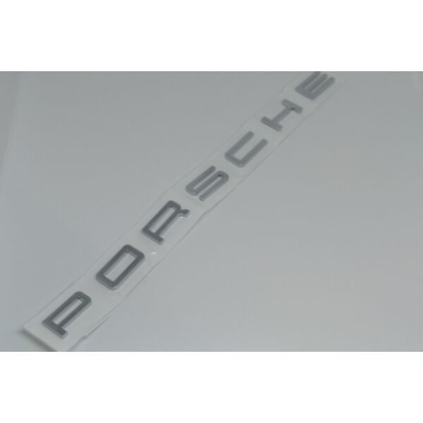 

Напис Porsche на кришку багажника метал 95В853687 Оригінал