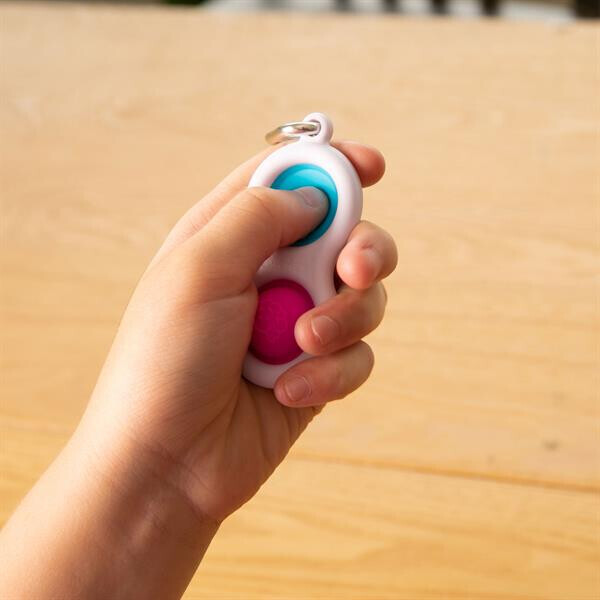 

Тактильний антистрес-брелок Кнопки Fat Brain Toys Simpl Dimpl 4 кольори в асорт. (F2111ML)