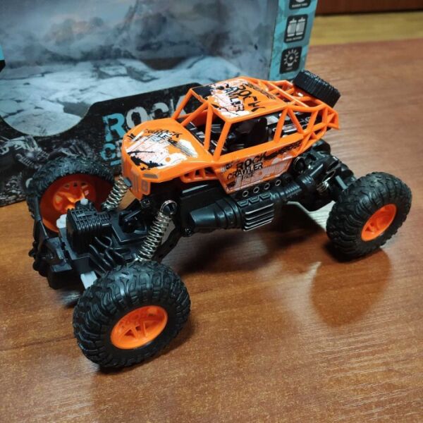 

Машинка на радиоуправлении Багги Military 1:18 Rock Crawler EL-TH476 Оранжевая