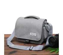 Придбати - сумку для фото- та відео  Фотосумка протиударна Canon EOS + дощовик, сірий колір (код: IBF038S)